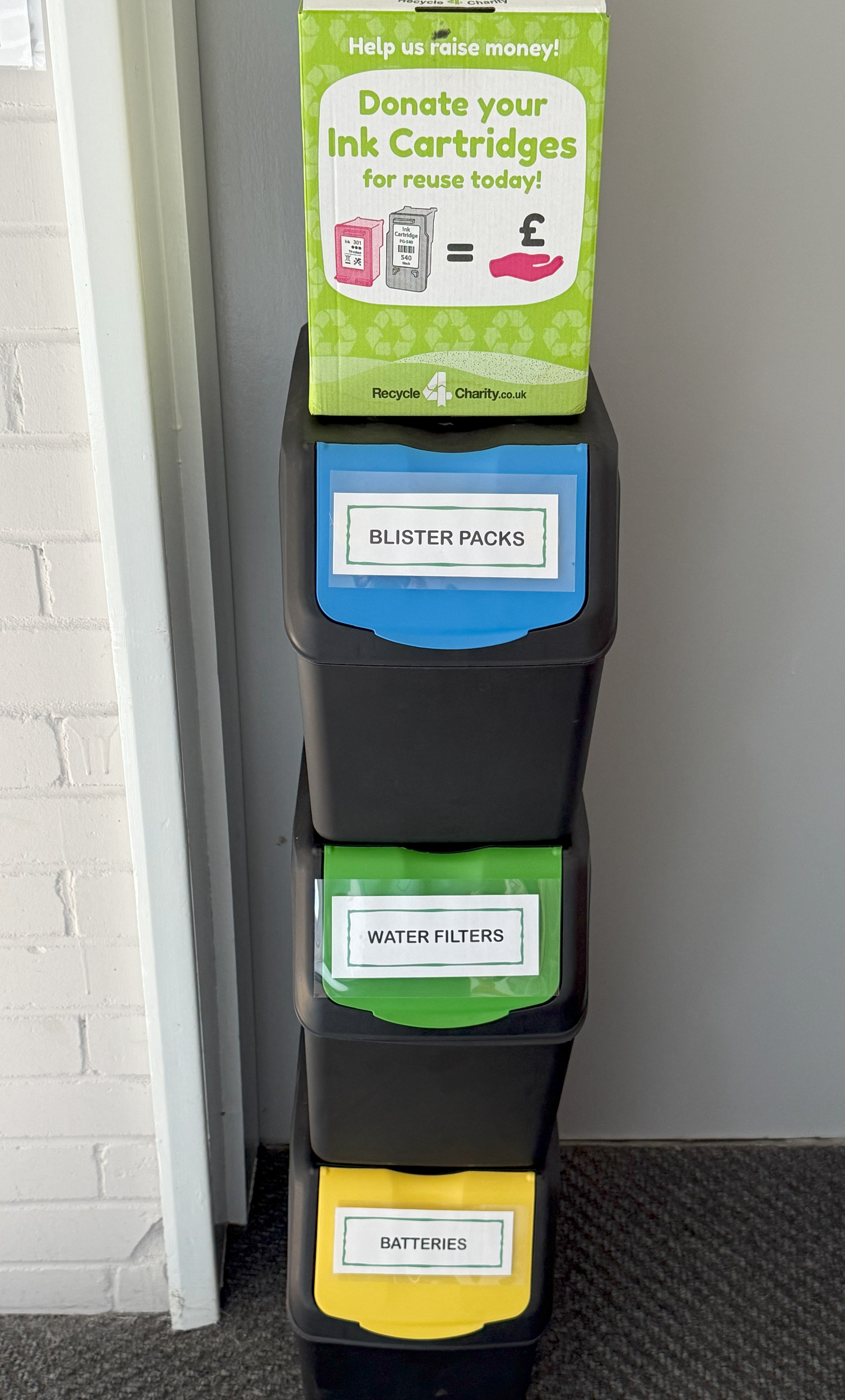 Photo of the recycling collection boxes in the village hall